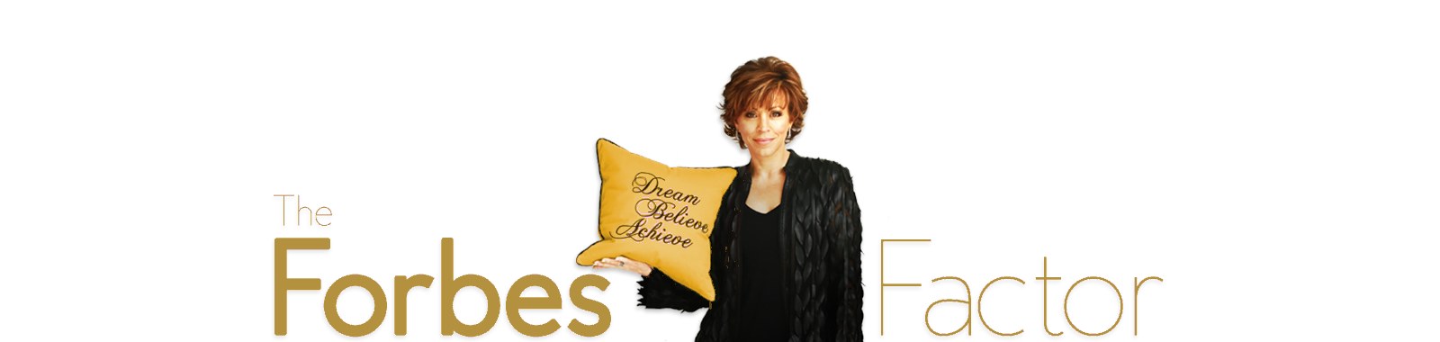 The Forbes Factor: Forbes Riley holding her Dream, Believe, Achieve pillow