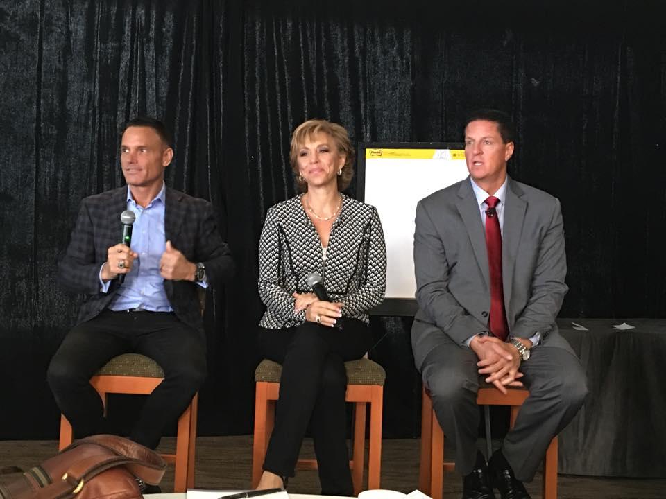 Forbes on a speaking panel with Kevin Harrington