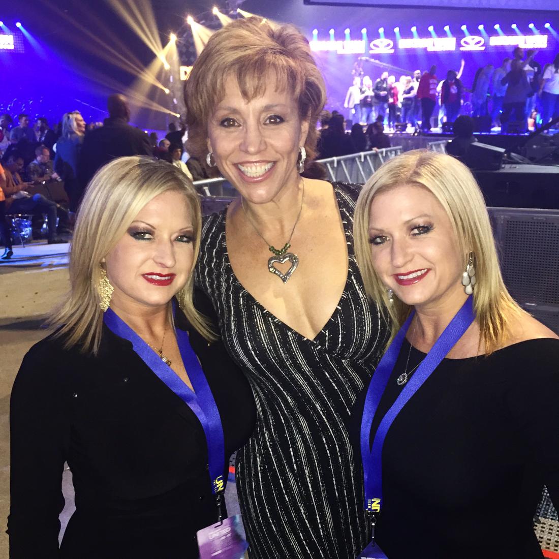Forbes with guests at an evening event