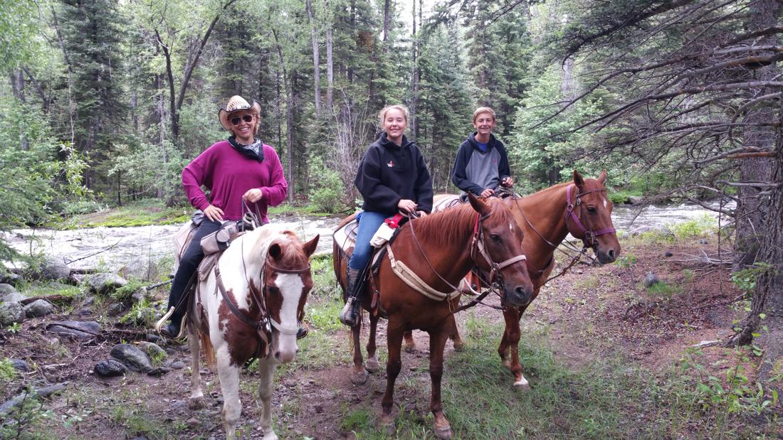 Forbes riding at the dude ranch
